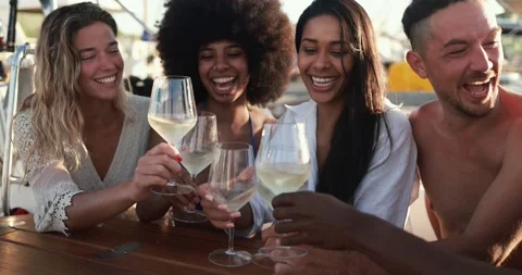 Happy multiracial friends having fun drinking champagne at boat party outdoor Stock Footage 199237128