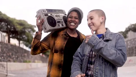 Happy multiracial friends having fun dancing and listening music with vintage Stock Footage 340298428