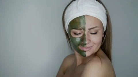 Happy, naked woman with cosmetic mask on... | Stock Video | Pond5