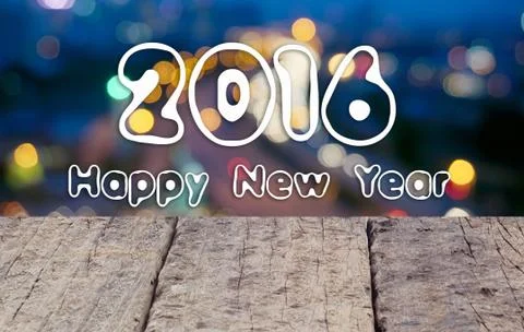 Happy New Year 2016 Text.With Wooden Desk And Abstract Blur Bokeh Background. Stock Photos
