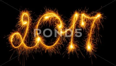 Happy New Year - 2017 with sparklers on black Stock Photos