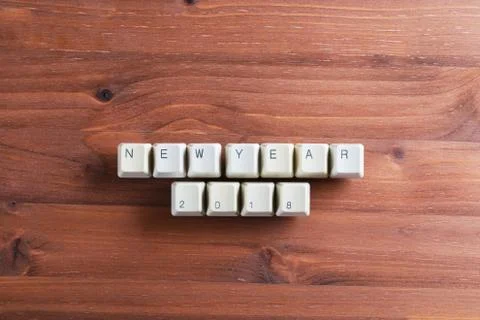 Happy new year 2018 on computer keyboard keys buttons on wooden background Foto stock