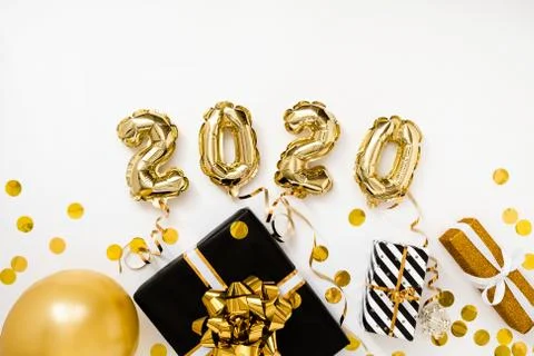 Happy New year 2020 celebration. Gold foil balloons numeral 2020 on white Stock Photos