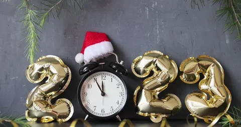 Happy new year 2023 background. Metallic balloons golden color on gray concrete Stock Footage 224091487