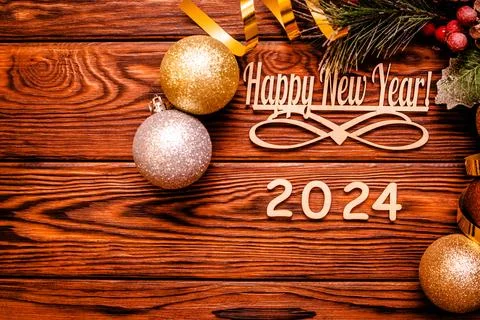 Happy new year 2024 on wooden brown background Stock Photos