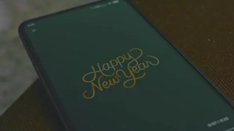 Happy new Year graphic presentation on smartphone screen Stock Footage 288964573