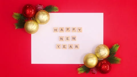 Happy new year text appear on white paper with Christmas ornaments.Stop motion Stock-Footage 162995877