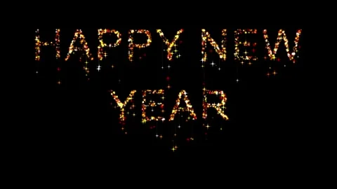 Happy New Year text with sparkles falling through it on dark screen Stock Footage 340812561