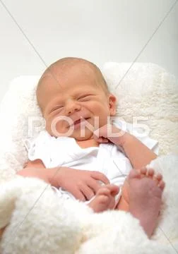 Happy newborn infant Stock Photos