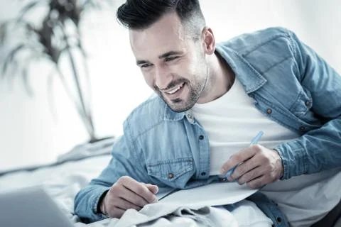 Happy nice man writing a plan Stockfoto's