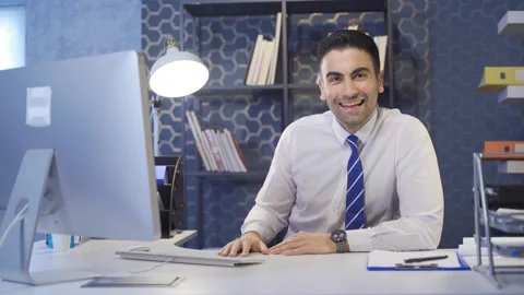 Happy office worker looking at camera. Video stock 213547110