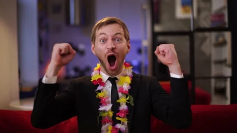 Happy office worker screaming Wow celebrating a won trip to Hawaii he dreamed of Stockbeeldmateriaal 167692907