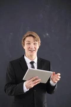 Happy office worker with a tablet Stock Photos