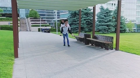 Happy office workers having fun outdoors in the park Stock Footage 77175796