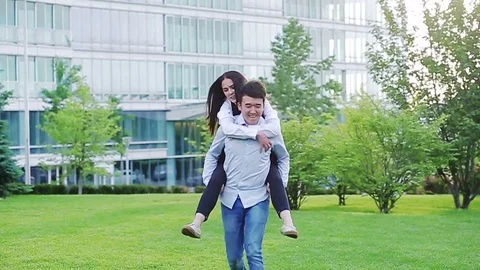 Happy office workers having fun outdoors in the park Stock Footage 77175826