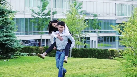 Happy office workers having fun outdoors in the park Stock Footage 77175881