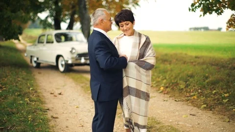 Happy old age. An elderly beautiful couple walking in the Park. Stock Footage 106404836
