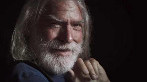 Happy old man in dark smiling at camera,portrait Stock Footage 75007012