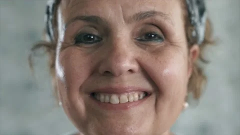 An happy old woman is smiling to camera. Close up shot of beauty elderly seni Stock Footage 132970153