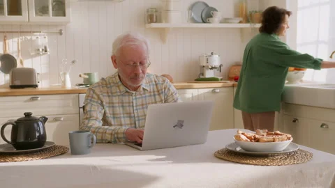 Happy older couple using laptop Video stock 264303527