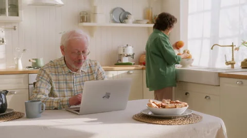 Happy older couple using laptop Stock Footage 264304312