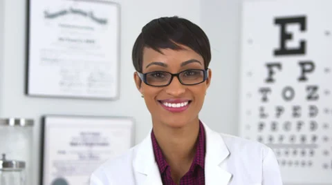 Happy optometrist looking at camera Stock Footage 32425344