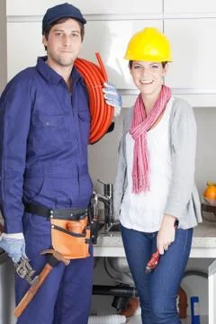 Happy pair of plumbers Stock Photos