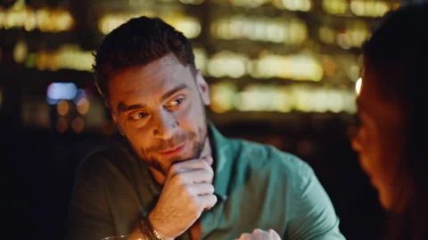 Happy partners spending date in cozy dark cafeteria closeup. Smiling man talking Stock Footage 334008576