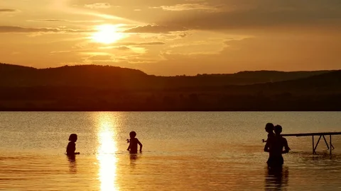 Happy people bathing in a beach at epic sunset lake Balaton, Hungary 動画素材 116124636