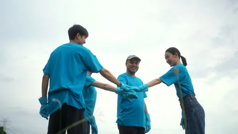 Happy people group putting stacking hands together in volunteering activities. Video stock 249034799