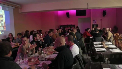 happy people having dinner in local disc... | Stock Video | Pond5