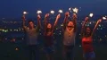 The happy people hold bengal lights. slow motion, evening night time HD Footage
