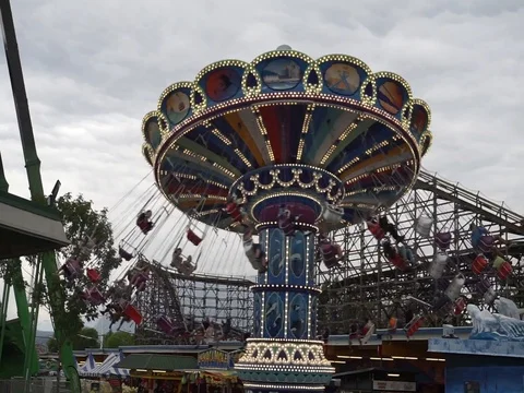 Happy people ride the carousel through the sky. Stock Footage 114346989