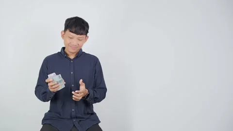 Happy Person Smiling While Holding Money Vidéo 344831096