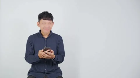 Happy Person Smiling While Looking at Smartphone 库存影片 344830418