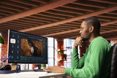 Happy person using computer to make use of text to video artificial intelligence Stock Photos