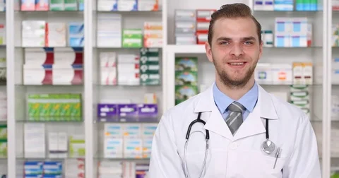 Happy Pharmacist Man Looking Camera Posing Smiling Pharmacy Store Presentation Stock Footage 77009567
