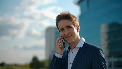 Happy positive man talking mobile phone. Concept for cheerful and friendly Stock Footage 121081366