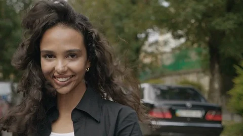 Happy positive Young Brunette posing on Camera. Walking in front of Objective Stock Footage 118095341