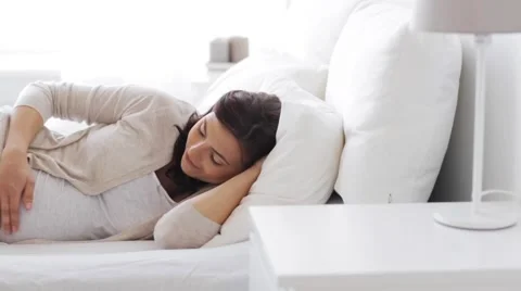 Happy pregnant woman touching her tummy at home 56 Stock Footage
