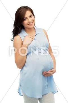 Happy pregnant woman touching her big belly Stock Photos