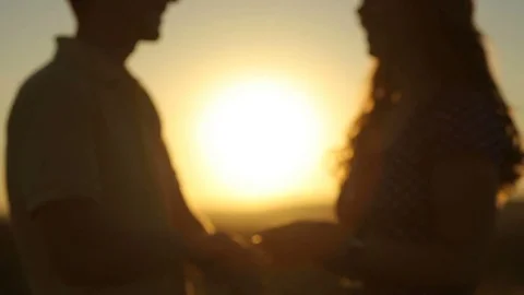 Happy pretty couple having fun outdoors through a field. Countryside. Stock Footage 79073907