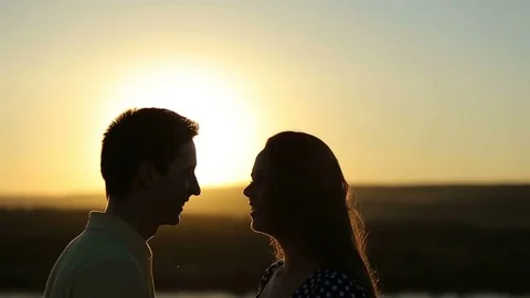 Happy pretty couple having fun outdoors through a field. Countryside. Stock Footage 79073992