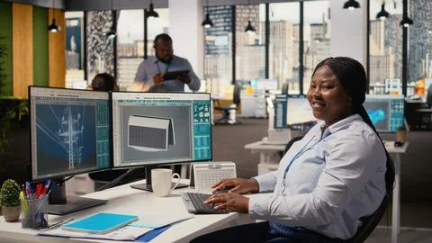 Happy product developer in office using advanced solar cell technology Stock Photos