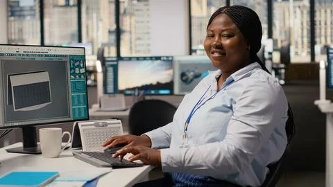 Happy product developer in office using advanced solar cell technology Stock Photos