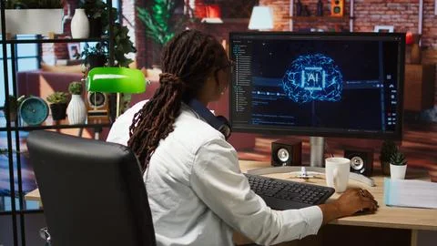 Happy programmer celebrating after successfully implementing AI code Stock Photos
