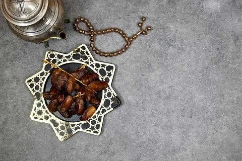 Happy ramadan or eid concept, deglet nour algeria dates in stars plate with rosa Stock Photos