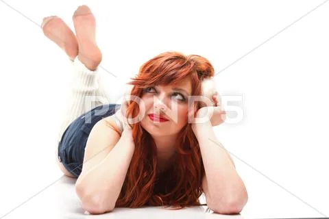 Happy redhairy woman girl in white headphones Stock Photos