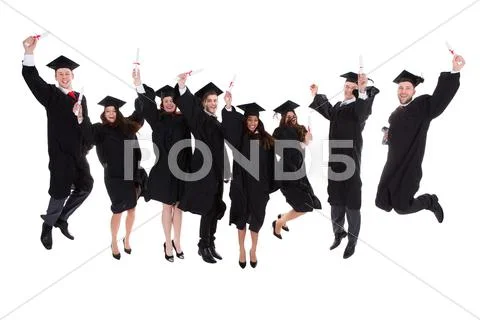 Happy rejoicing group of multiethnic graduates Stock Photos