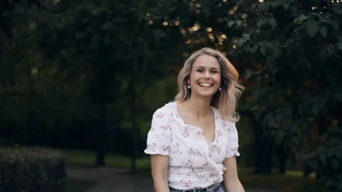 Happy relaxed lady walking in summer park enjoying nature, warmth and vacation Stock Footage 242598016